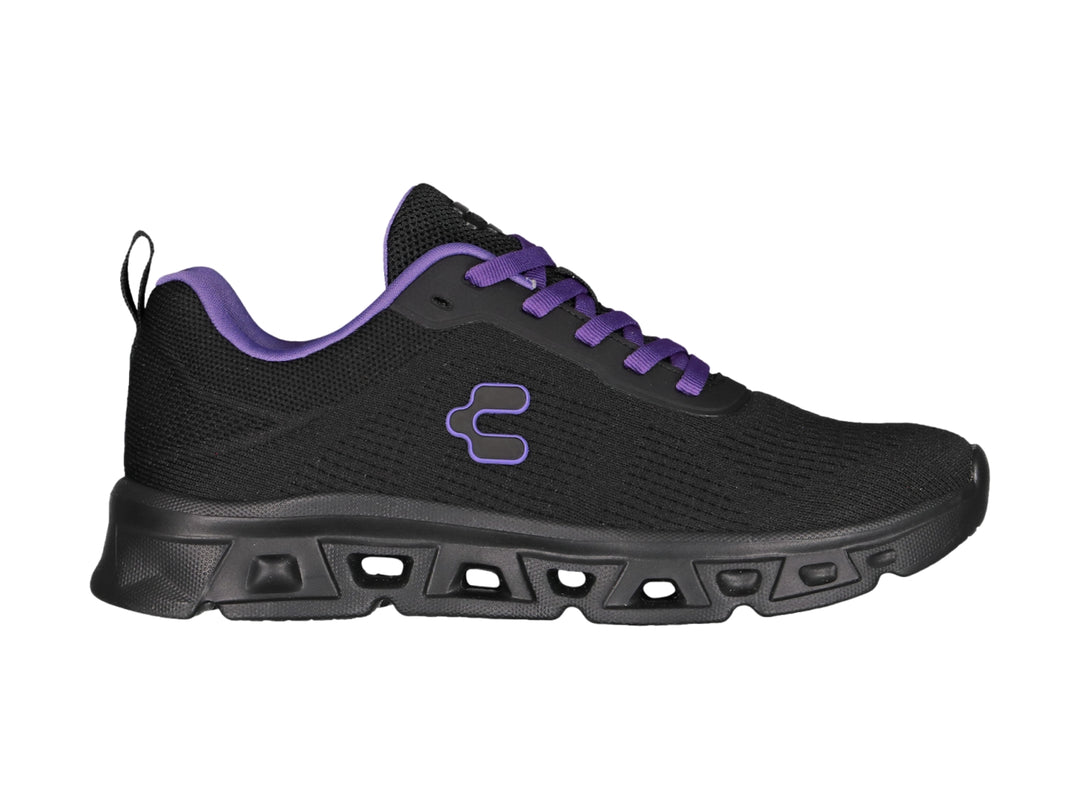 Tenis deportivos Charly color negro con agujetas y detalles en morado.