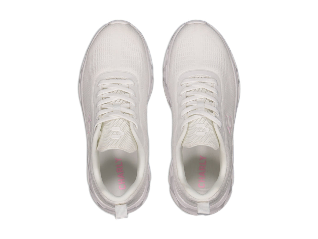 Tenis deportivos Charly color blanco con detalles en rosa y suela blanca robusta.