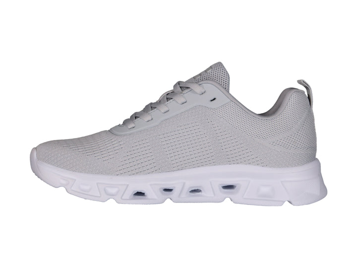 Tenis deportivos Charly color gris con suela blanca y detalles en malla.