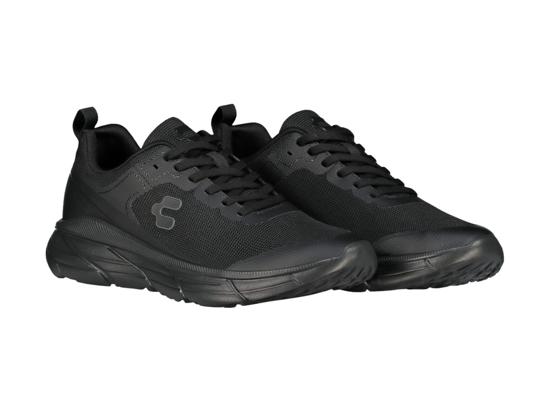 Tenis deportivos Charly color negro total con suela robusta y parte superior de malla transpirable.
