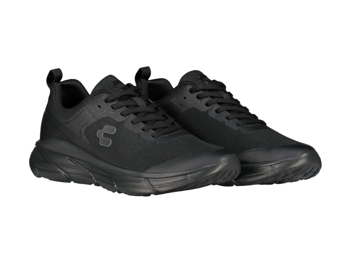 Tenis deportivos Charly color negro total con suela robusta y parte superior de malla transpirable.