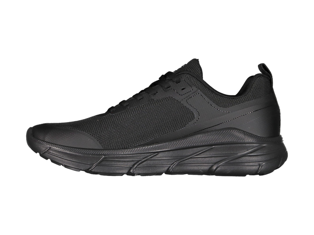 Tenis deportivos Charly color negro total con suela robusta y parte superior de malla transpirable.