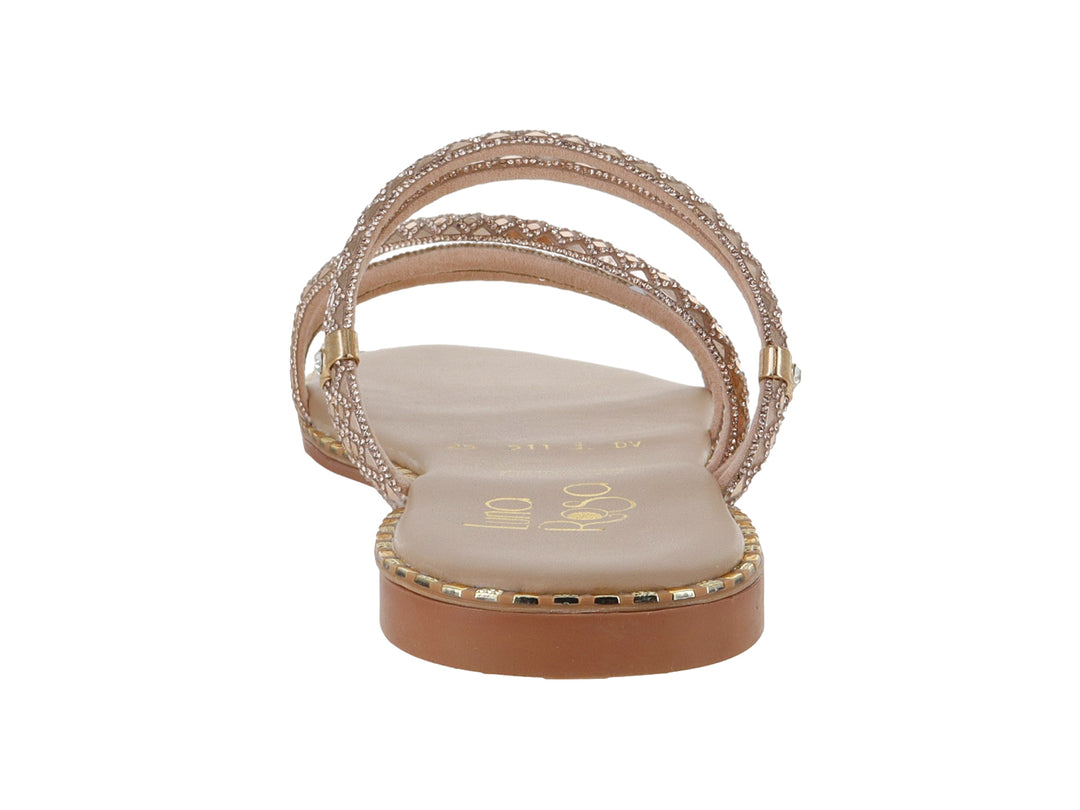 Sandalia plana para niña en color oro rosado con correas brillantes y suela delgada.
