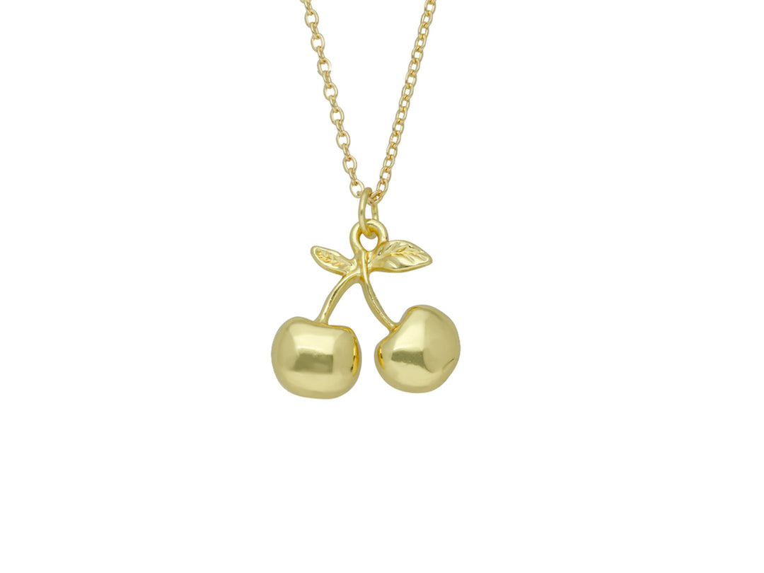 Collar dorado de la marca ROZE con un dije en forma de dos cerezas brillantes y una pequeña hoja.