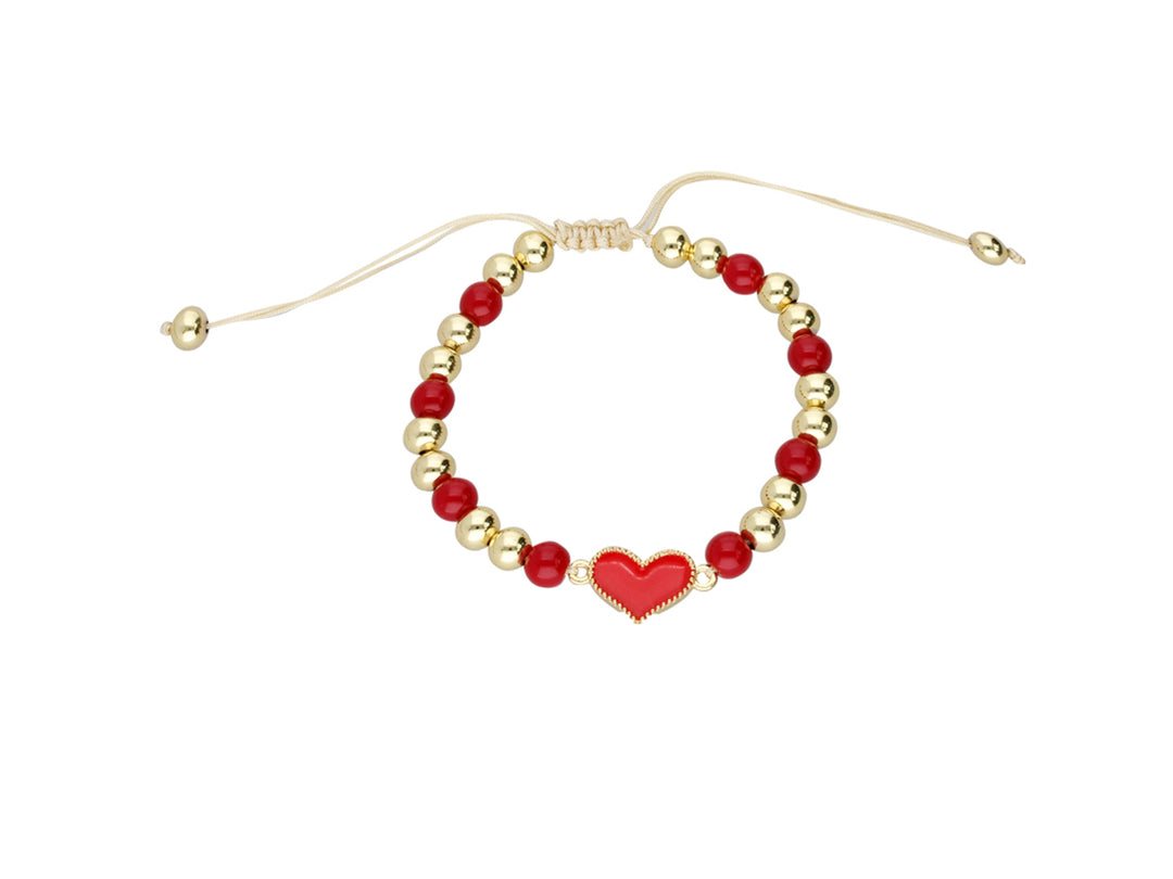 Pulsera de cuentas doradas y rojas con un dije central en forma de corazón rojo y cierre ajustable.