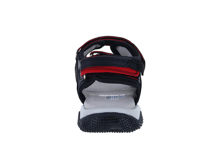 Sandalia New Boys color negro con detalles en rojo y suela blanca.