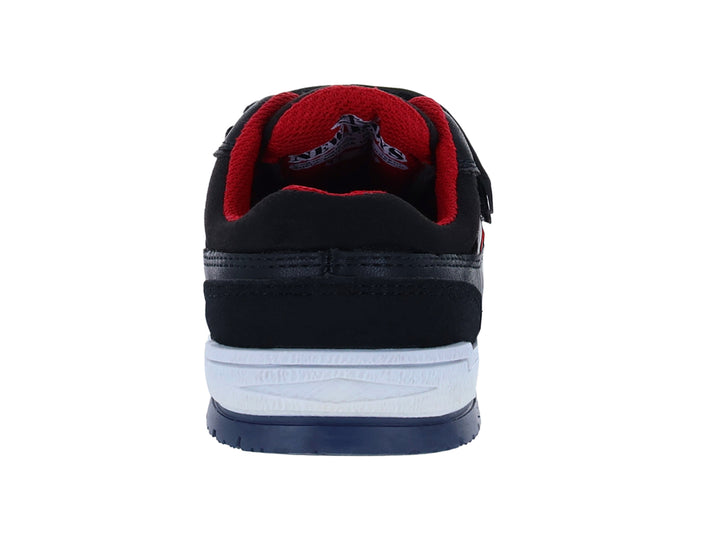 Zapato infantil negro con detalles rojos, suela blanca y azul, y cierre de velcro.