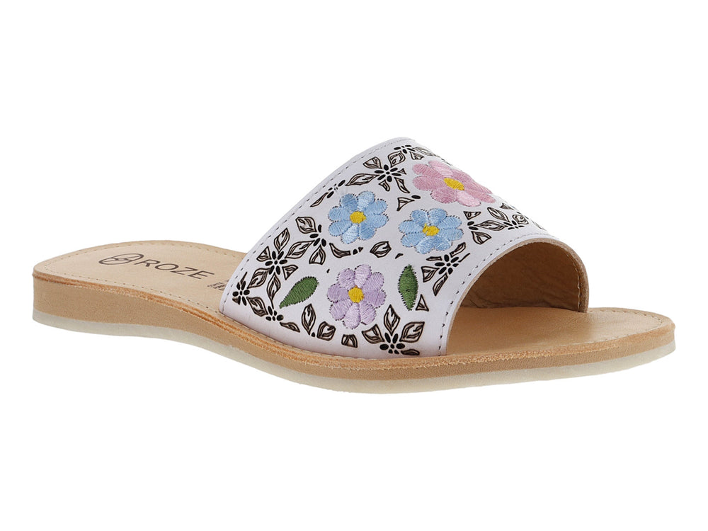 Sandalia blanca para niña con diseño de flores coloridas en la banda superior y suela beige.