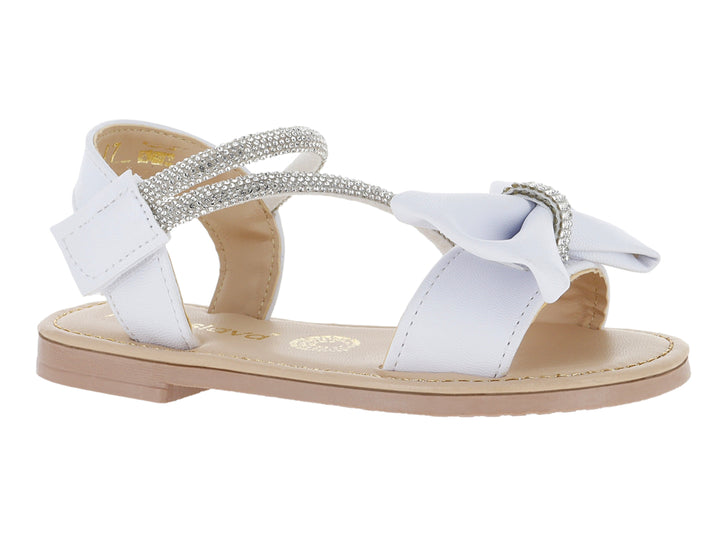 Sandalias blancas para niña con detalle de moño y correa con glitter plateado.