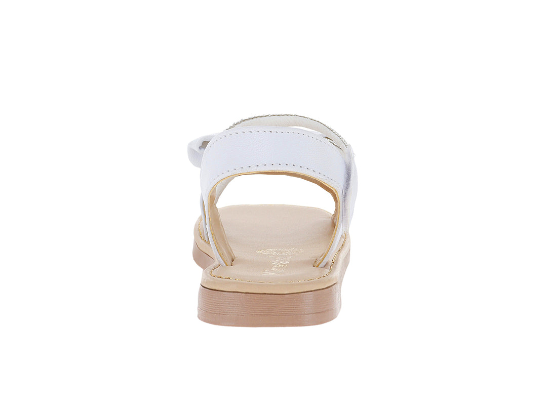 Sandalias blancas para niña con detalle de moño y correa con glitter plateado.