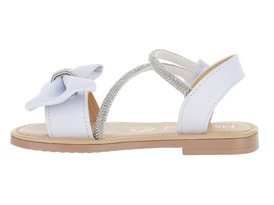 Sandalias blancas para niña con detalle de moño y correa con glitter plateado.