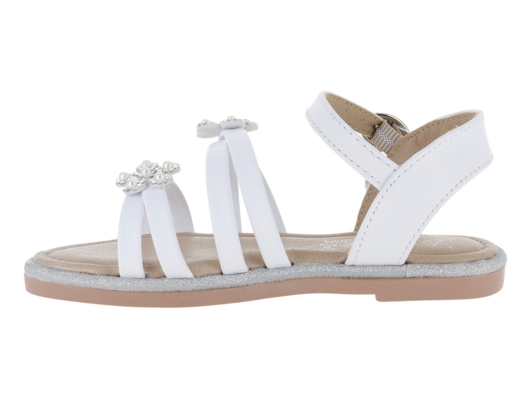 Sandalia blanca para niña con adornos de flores brillantes y suela plateada.