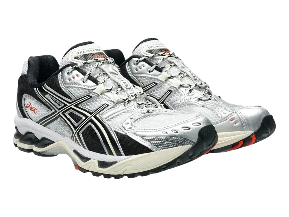 Tenis deportivos ASICS Gel-Nimbus 10.1 en colores blanco, negro y gris con detalles en rojo.
