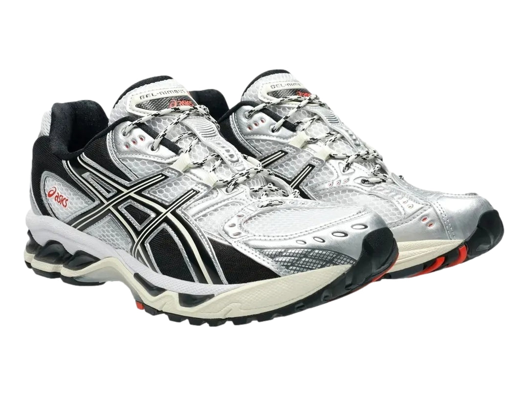 Tenis deportivos ASICS Gel-Nimbus 10.1 en colores blanco, negro y gris con detalles en rojo.