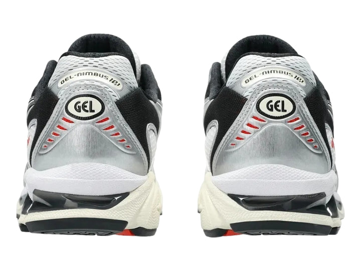 Tenis deportivos ASICS Gel-Nimbus 10.1 en colores blanco, negro y gris con detalles en rojo.