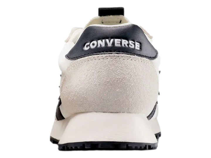 Tenis Converse Omega Trainer blancos con detalles y suela negra para niño.