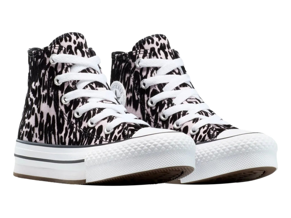 Tenis Converse de bota con estampado animal en tonos morado y negro con suela blanca elevada.