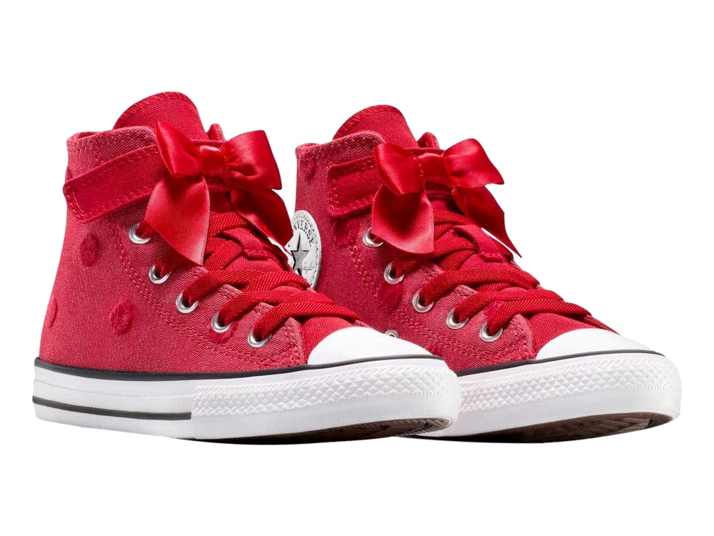 Tenis Converse rojos de bota con moño decorativo y suela blanca.
