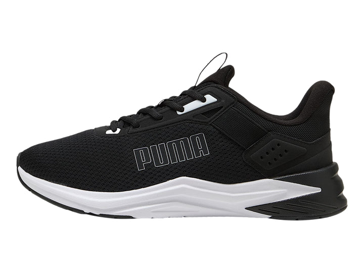 Tenis deportivos PUMA color negro con suela blanca, vista lateral.