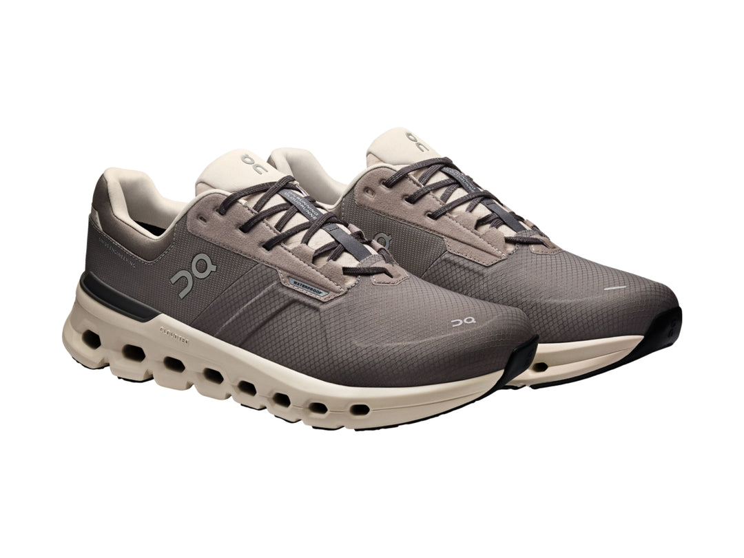 Tenis deportivos On Cloud color gris eclipse con suela beige y diseño moderno.