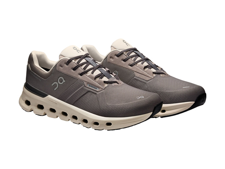 Tenis deportivos On Cloud color gris eclipse con suela beige y diseño moderno.