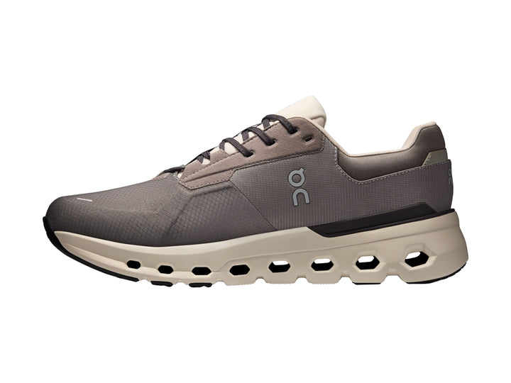 Tenis deportivos On Cloud color gris eclipse con suela beige y diseño moderno.