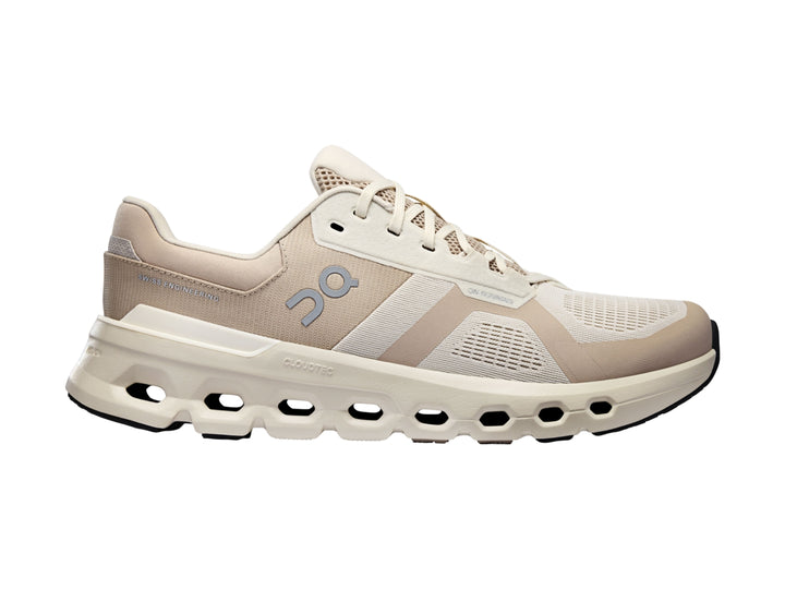 Tenis deportivos On Cloud en tonos beige y blanco con suela amortiguada característica.