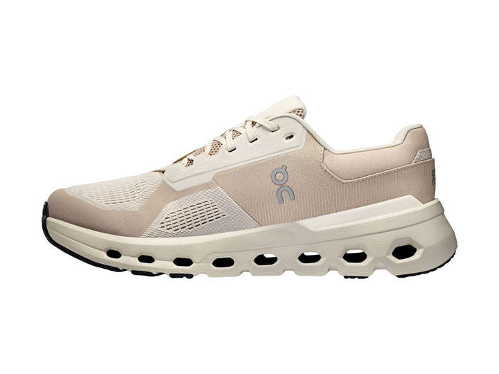 Tenis deportivos On Cloud en tonos beige y blanco con suela amortiguada característica.