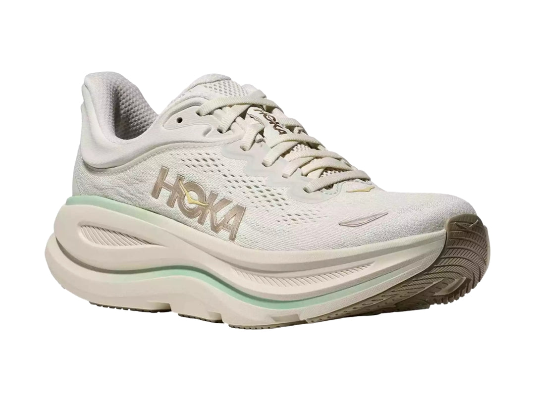 Tenis HOKA Bondi 9 color blanco crema con detalles en verde menta y suela amortiguada