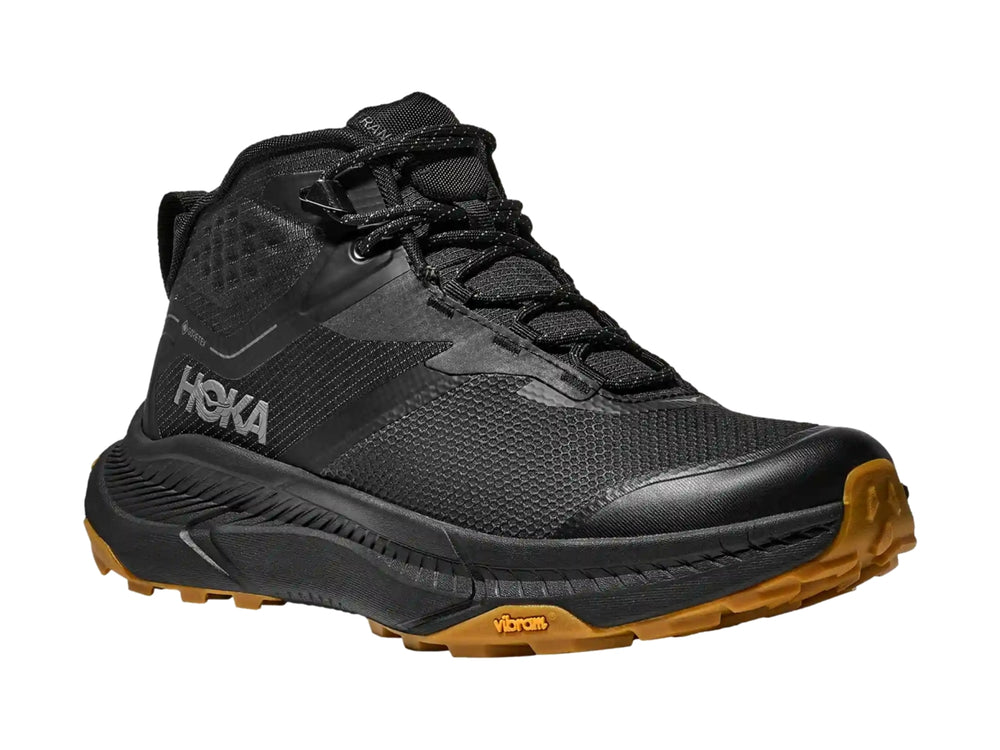 Bota de senderismo HOKA Transport Hike GTX en color negro con suela marrón y detalles técnicos.