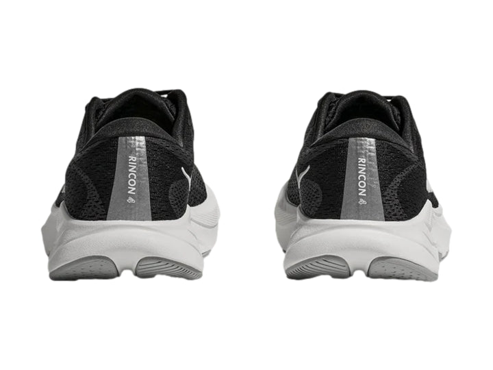 Tenis deportivos HOKA Rincon 4 para niños en color negro con suela blanca y logotipo blanco lateral.