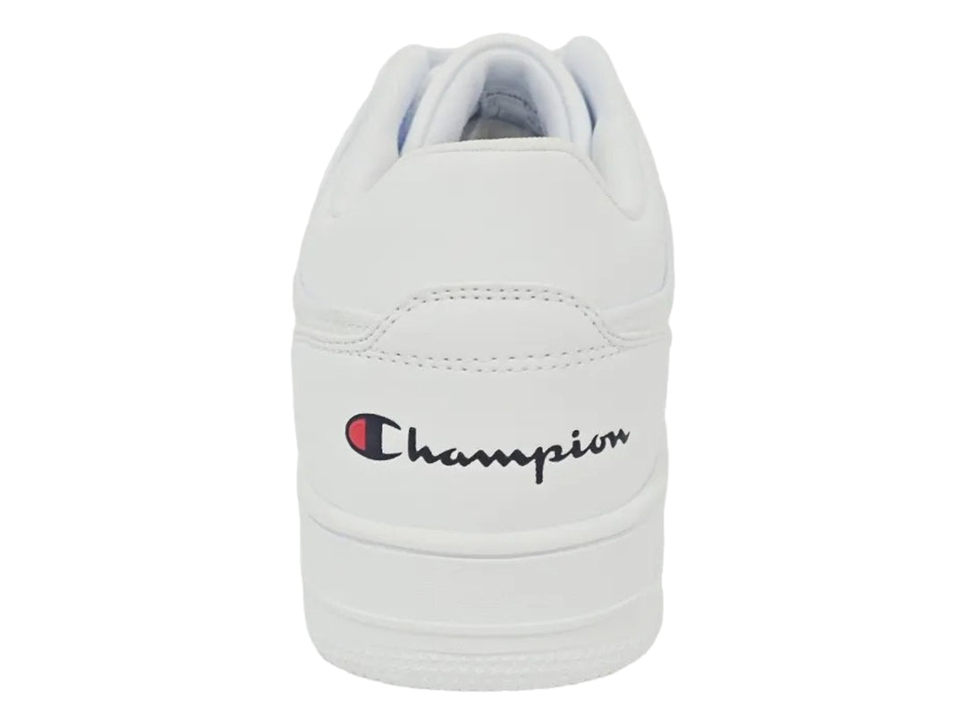 Tenis deportivos Champion de color blanco con logotipo lateral en rojo y azul, diseño casual y suela plana.