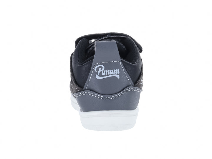 Tenis infantiles Panam color negro oxford con suela blanca y ajuste de velcro.