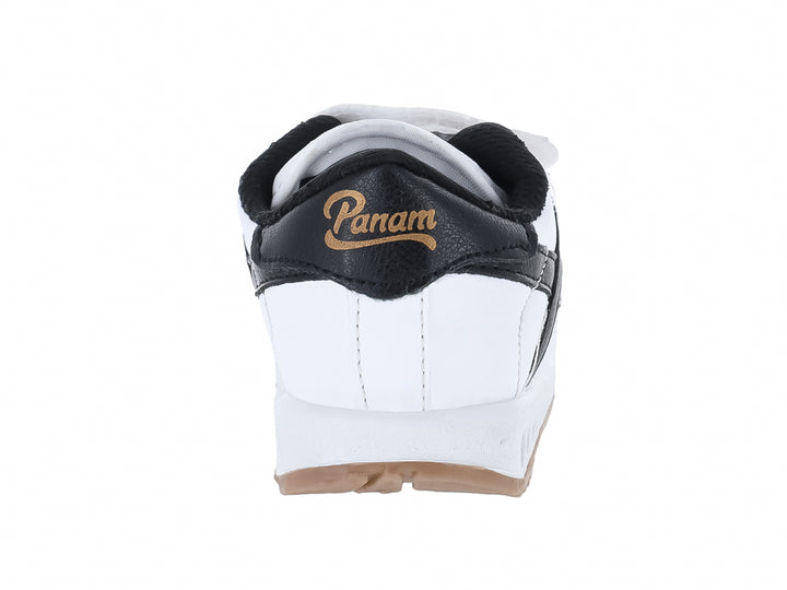 Tenis infantiles Panam blancos con detalles en negro y suela de goma, cierre con velcro.