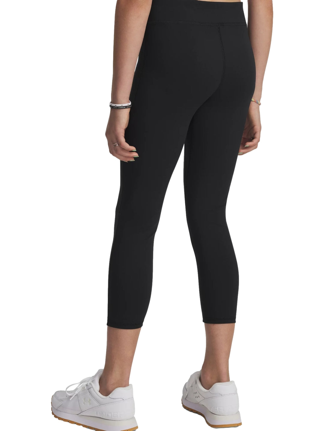 Leggings deportivos negros Under Armour de corte al tobillo y ajuste ceñido.