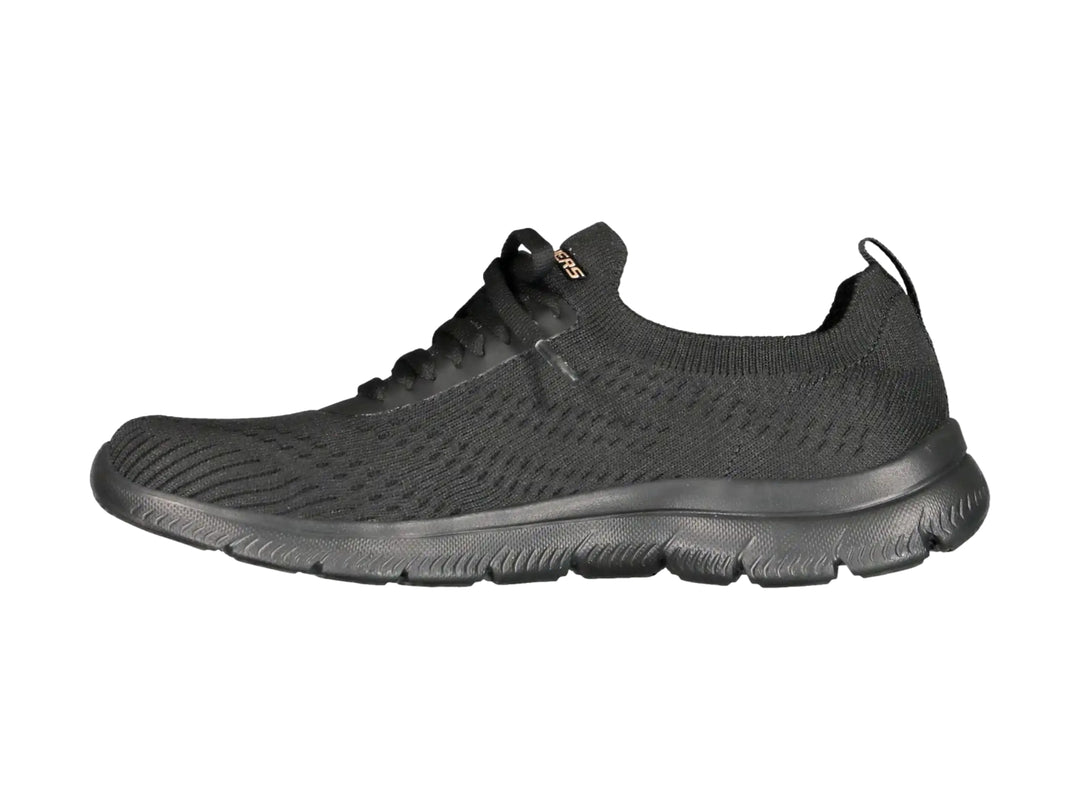 Tenis deportivos Skechers para mujer en color negro con detalles dorados y suela flexible.