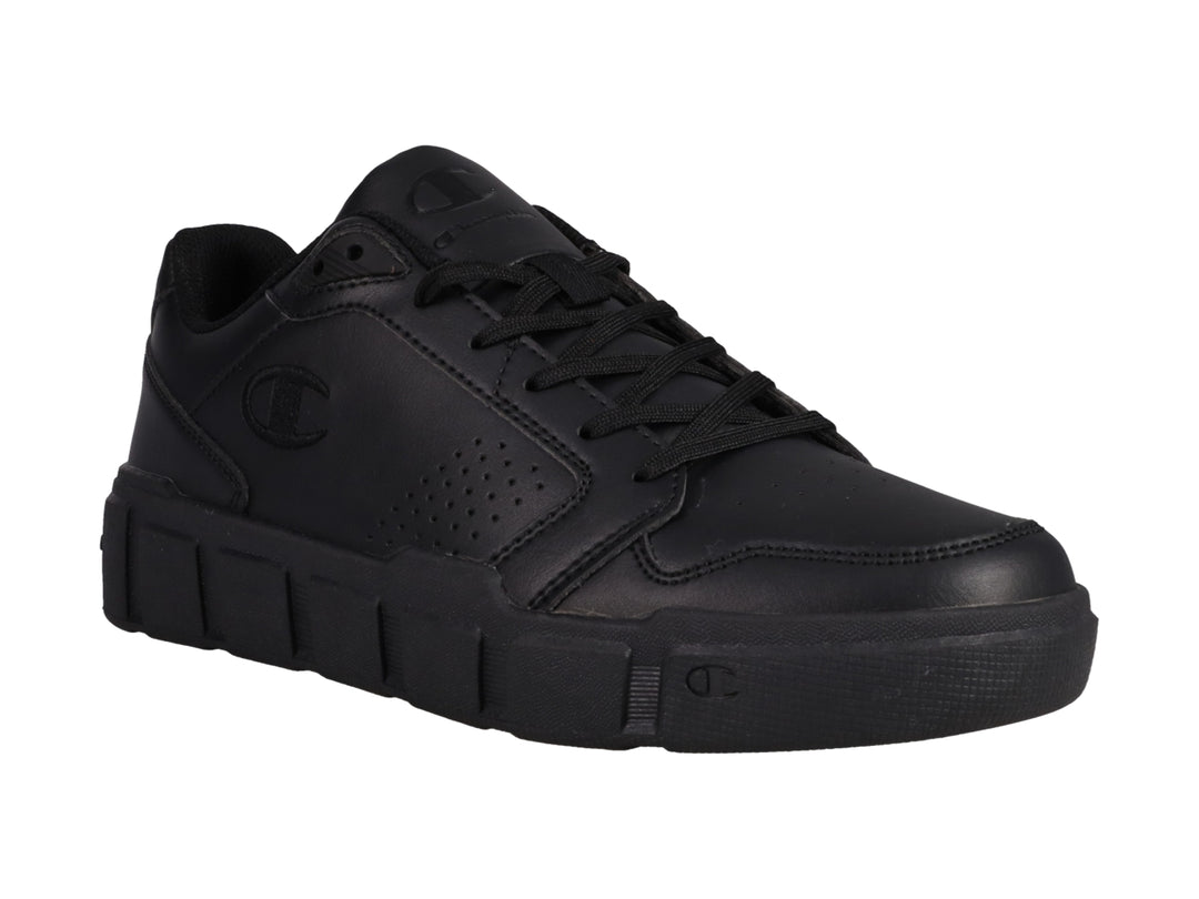 Tenis Champion color negro con suela gruesa y detalles perforados.