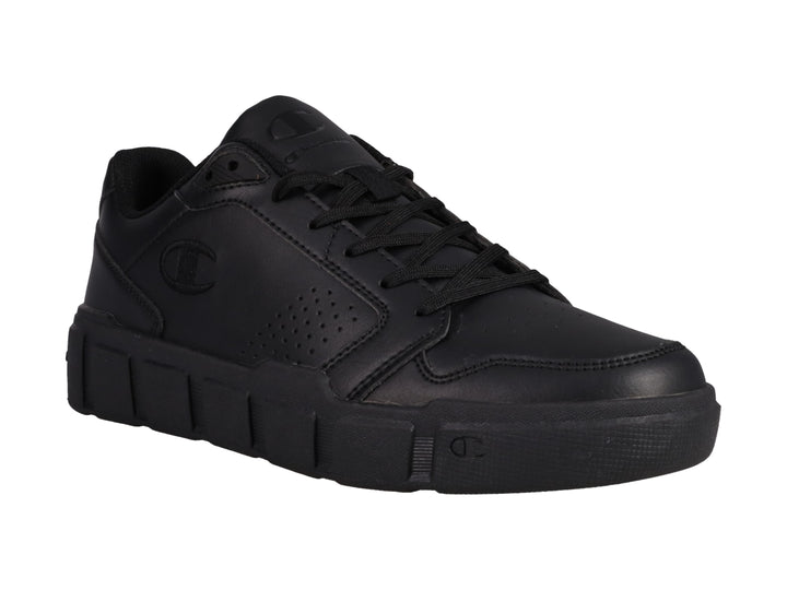 Tenis Champion color negro con suela gruesa y detalles perforados.