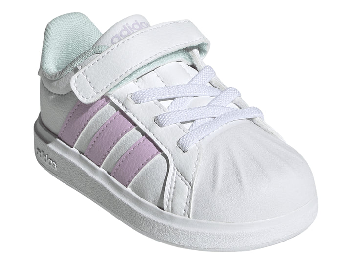 Tenis Adidas blancos con franjas lila y detalles en menta, con cierre de velcro y agujetas.