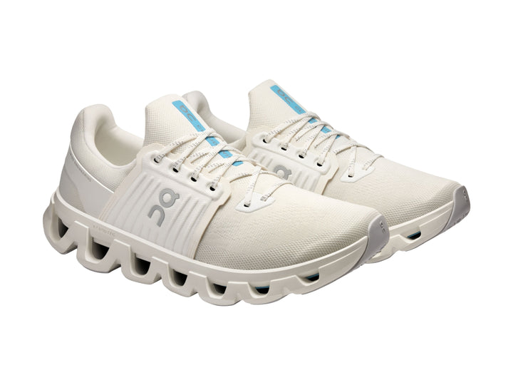 Tenis deportivos On Cloud en color ivory con suela característica de nubes y diseño moderno.