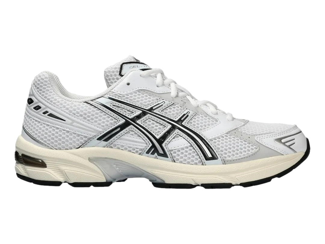 Tenis deportivos ASICS GEL-1130 color blanco y gris con detalles negros, vista lateral.