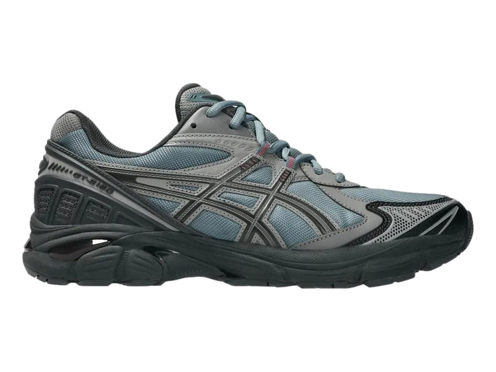 Tenis deportivos ASICS GT-2160 en color gris y azul con suela robusta y malla transpirable.