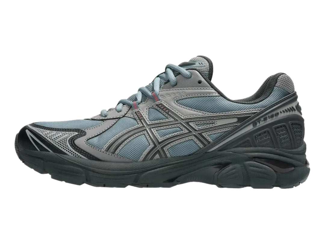Tenis deportivos ASICS GT-2160 en color gris y azul con suela robusta y malla transpirable.