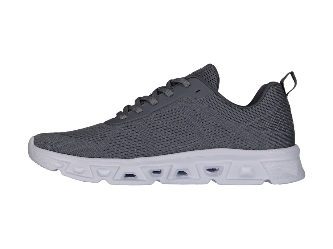 Tenis deportivos Charly color gris Oxford con suela blanca y tejido de malla.