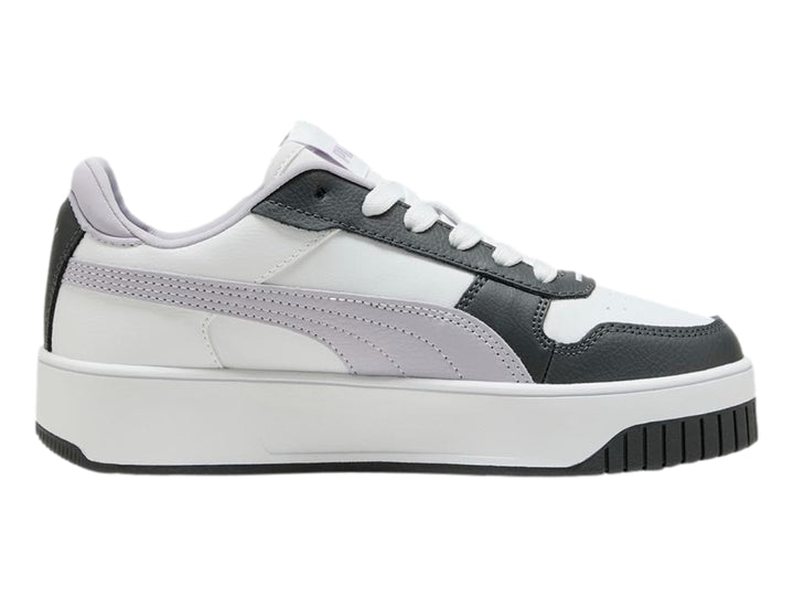 Tenis PUMA Carina Street JR en color blanco con detalles en gris y lila, con suela de plataforma blanca.