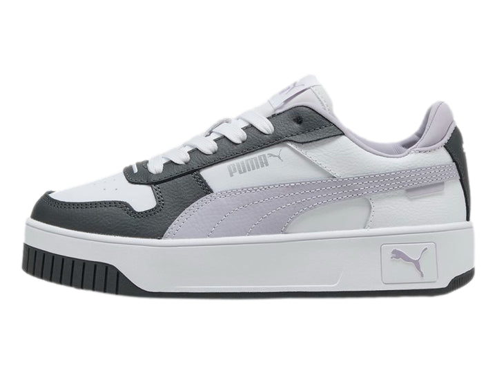 Tenis PUMA Carina Street JR en color blanco con detalles en gris y lila, con suela de plataforma blanca.