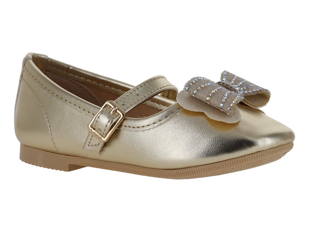 Zapato tipo ballerina color oro inglés para niña con moño decorativo y correa con hebilla.