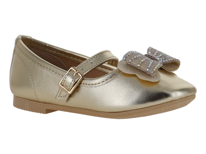 Zapato tipo ballerina color oro inglés para niña con moño decorativo y correa con hebilla.