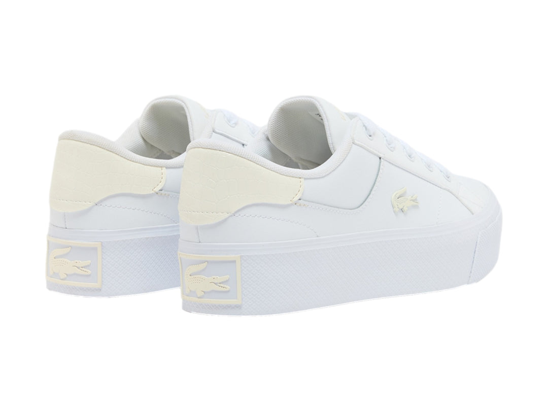 Tenis Lacoste blancos de plataforma con detalles en color crema y suela gruesa blanca.