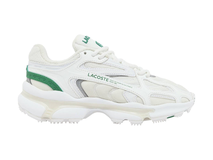 Tenis deportivos Lacoste blancos con detalles en verde y suela gruesa.